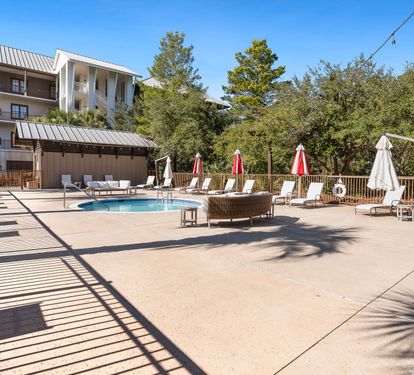 Soak up the sun by the pool, surrounded by lush greenery and comfortable loungers for the perfect relaxation retreat.