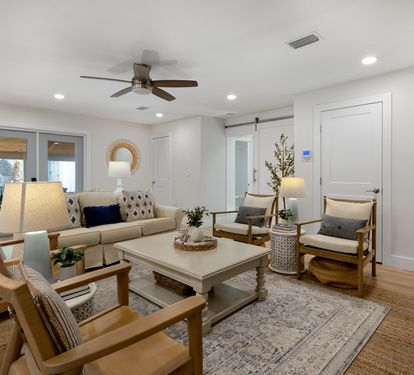 Relax in your thoughtfully designed living room with comfortable seating, warm wood accents, and modern touches that create the perfect atmosphere for unwinding.