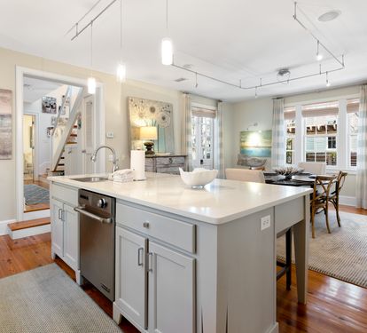 Your spacious kitchen features a gleaming marble island and modern appliances, perfect for preparing memorable meals during your stay.