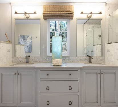 Refresh in your elegant marble bathroom with dual vanities, rainfall shower, and spa-like serenity.