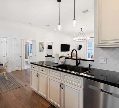 Your gourmet kitchen features elegant granite counters, custom cabinetry, and premium appliances for memorable meal prep.