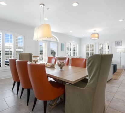 Gather around your stylish dining table where warm leather chairs invite memorable meals and conversation.