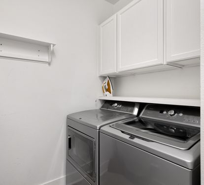 Your dedicated laundry space features modern appliances and built-in storage, making it easy to keep your belongings fresh during your stay.