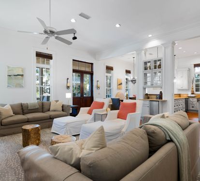Relax in this bright, airy living space where plush sofas and open-concept design create the perfect gathering spot for your group.