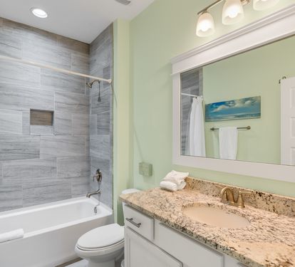 Unwind in your elegant bathroom with granite counters, modern tile work, and a soaking tub perfect for relaxing after your adventures.