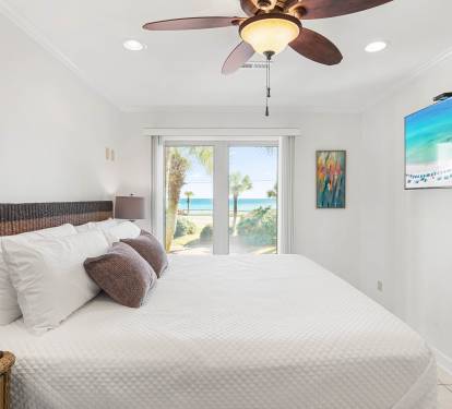 Wake up to stunning ocean views from your comfortable bed. The ceiling fan keeps you cool while you enjoy the coastal scenery.