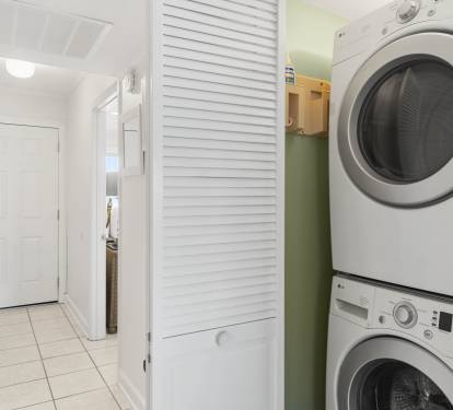 Your convenient in-unit laundry closet keeps fresh clothes just steps away, tucked neatly behind stylish louvered doors for seamless living.