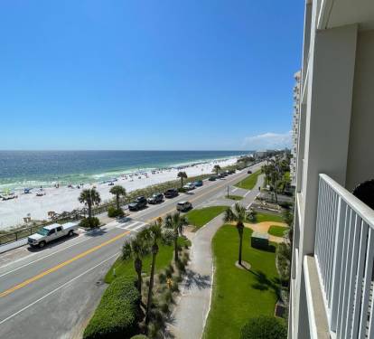 A view of the beach looking west from the balcony of the condo.