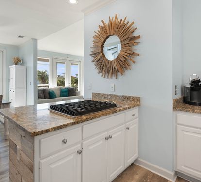 Your open-concept kitchen flows beautifully into the living space, featuring granite countertops and modern appliances for effortless meal preparation.