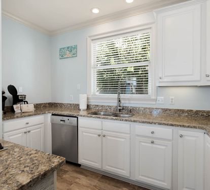 Your fully equipped kitchen features granite countertops, stainless steel appliances, and everything you need for memorable meals during your stay.