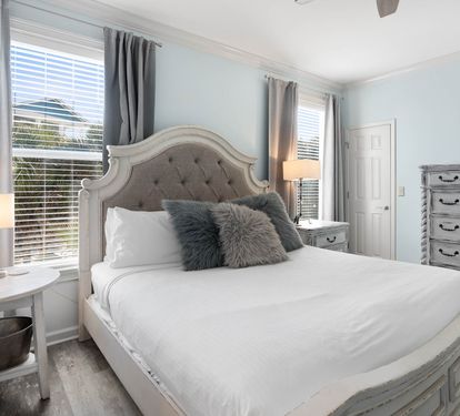 Unwind in your elegant bedroom with plush linens and calming blue tones that promise peaceful nights of rest.