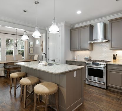 Your gourmet kitchen features granite countertops, stainless steel appliances, and a breakfast bar where you can savor morning coffee.