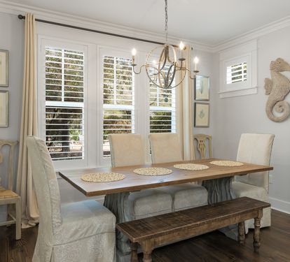 Gather around your elegant dining table where coastal charm meets comfort, perfect for memorable meals with loved ones.