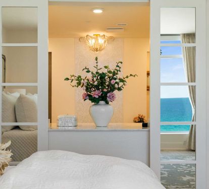 Privacy Screen Doors to the Primary Bath Allows for Views when you want them