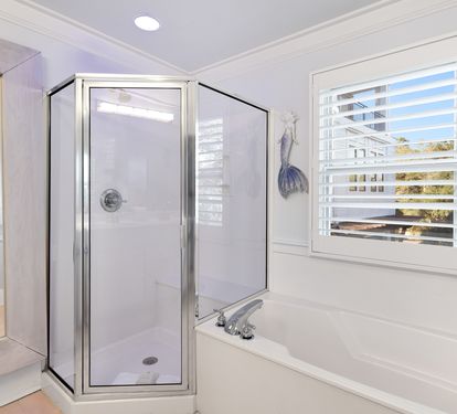 Unwind in your elegant master bathroom with a luxurious soaking tub and separate glass shower.
