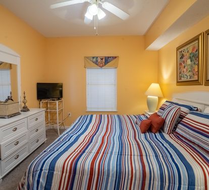 Primary bedroom with flatscreen television.