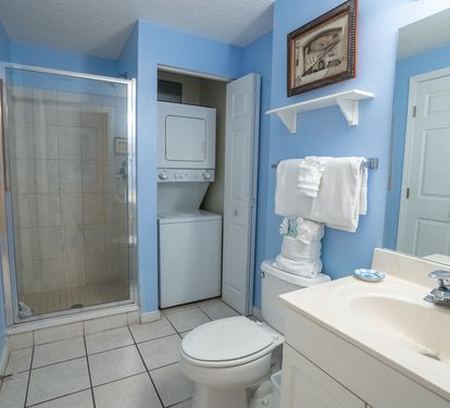 Guest bathroom with a walk in shower.