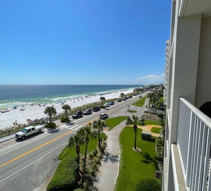 A view of the beach looking west from the balcony of the condo.