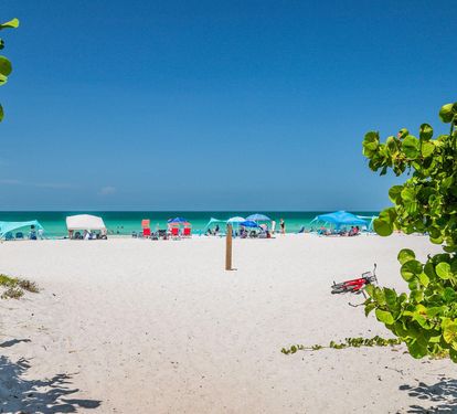 Soft white sand and turquoise Gulf water await at the end of the path — this is the view that's just a short stroll from your door.