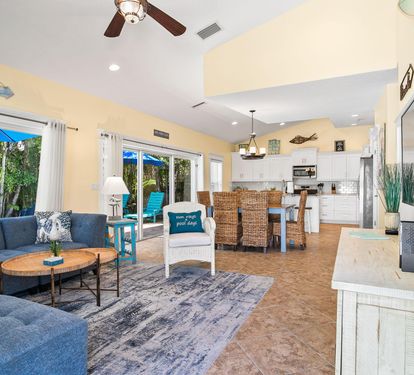 The open floor plan connects the living room to the fully equipped kitchen, making it easy for the whole group to stay together.