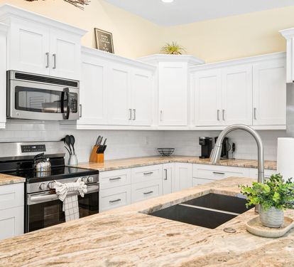 A closer look at the fully equipped, stainless steel kitchen — ready for everything from quick breakfasts to full family dinners.