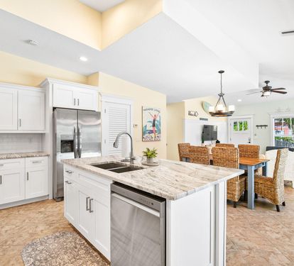 The kitchen island opens right into the dining and living spaces, keeping the whole group connected while cooking.