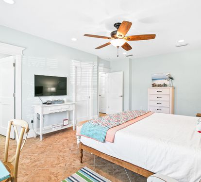 Another angle of this bedroom, with easy access to the bathroom and plenty of natural light.