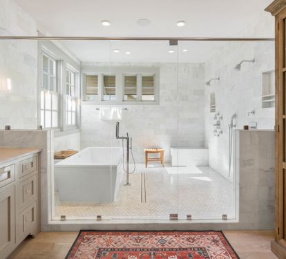 Luxurious spa-inspired bathroom with marble shower, soaking tub, and elegant finishes for your perfect retreat.