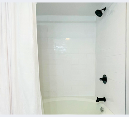 Your private bathroom features a clean tub-shower combo with modern fixtures, perfect for unwinding after your adventures.