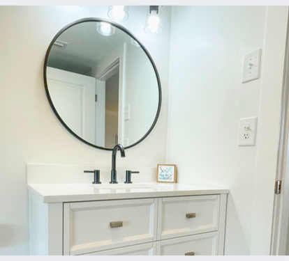 Your bright bathroom vanity offers clean lines and ample storage for your morning routine.