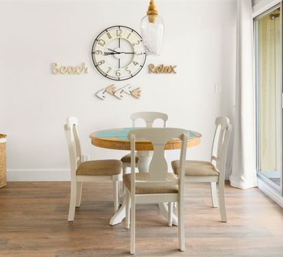 Gather around your coastal dining table where beach-themed wall art sets the perfect mood for memorable meals together.
