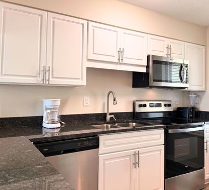 Your fully equipped kitchen features modern appliances, granite countertops, and plenty of cabinet space—perfect for preparing meals during your stay.