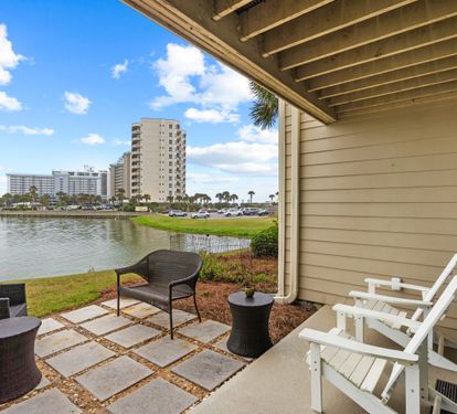 Relax on your private patio with serene lake views and comfortable seating perfect for morning coffee or evening sunset watching.