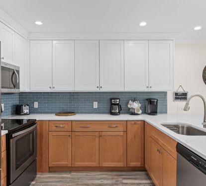 Your fully equipped kitchen awaits with modern appliances, ample counter space, and everything you need to create delicious meals during your stay.