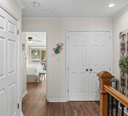 Step into your welcoming hallway with gleaming hardwood floors and bright, airy spaces leading to comfortable bedrooms.