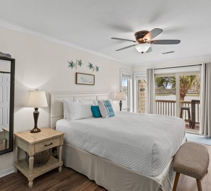Wake up in your coastal bedroom with palm tree views from your private balcony.