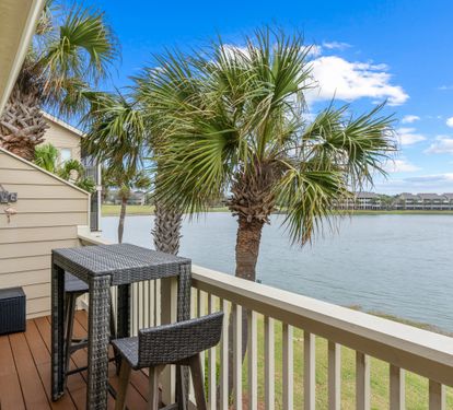 Sip your morning coffee on your private deck while watching palm trees sway over tranquil waters.