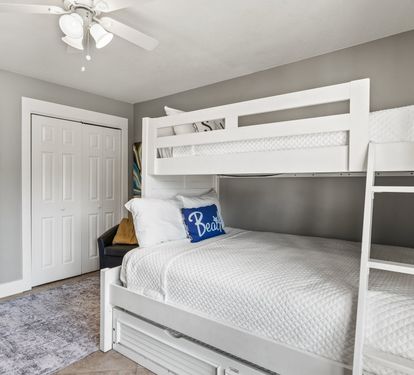 Cozy guest bedroom with bunk beds—perfect for kids, teens, or extra guests after a fun day at the beach.