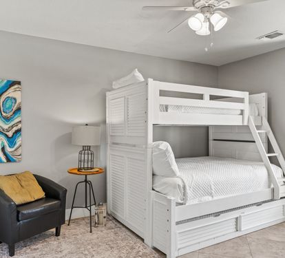 Comfortable bunk room with a twin-over-queen bunk bed and queen trundle—ideal for families and larger groups.