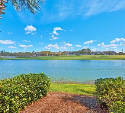 Peaceful north-facing lake and golf course views from the back of the unit create a relaxing coastal setting.