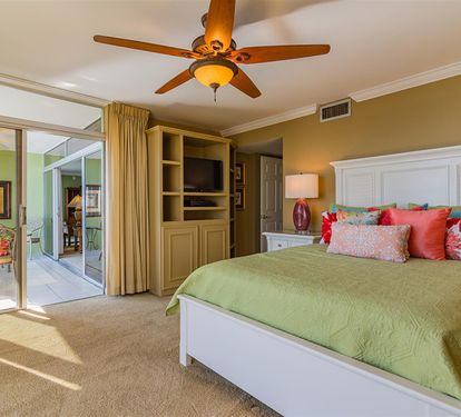 Wake up refreshed in your comfortable bedroom with cheerful tropical colors and sliding doors to your private balcony.