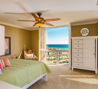 Wake up to stunning ocean views from your comfortable bedroom with tropical breezes from the ceiling fan.