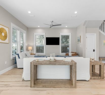 Unwind in your bright, airy living space with modern coastal charm and natural wood accents that create the perfect retreat.