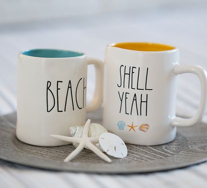 Condo features Rae Dunn mugs with the perfect wording