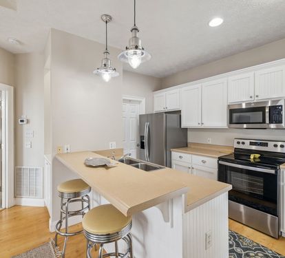 Offering Stainless Steel Appliances & Bar Seating for 2