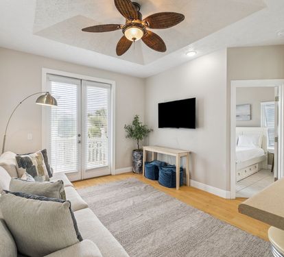 Cozy Living Area - Offering a Flat-Screen TV & Balcony Access