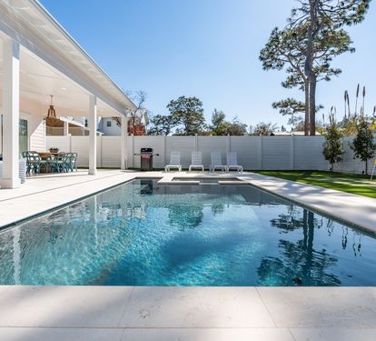 Dive into your private oasis where crystal-clear waters reflect sunny skies, while your covered patio offers the perfect poolside retreat.