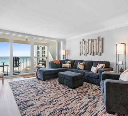 Sink into plush seating while your eyes drink in stunning ocean views through floor-to-ceiling windows. Your perfect retreat awaits.