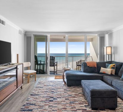 Sink into this plush sectional and let ocean waves fill your view through floor-to-ceiling windows.