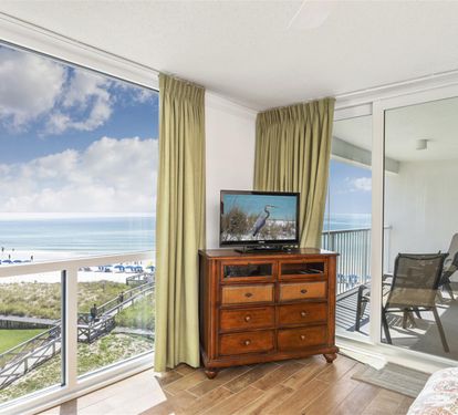 Watch the ocean waves from your private balcony or relax inside with stunning beach views through floor-to-ceiling windows.